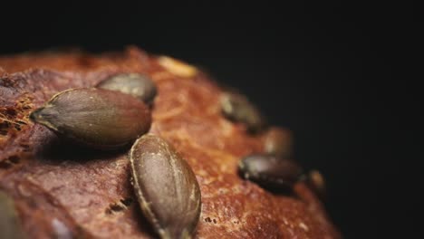 Toasted-bread-crust-covered-by-various-delicious-seeds-baked-in-the-oven,-macro-shot