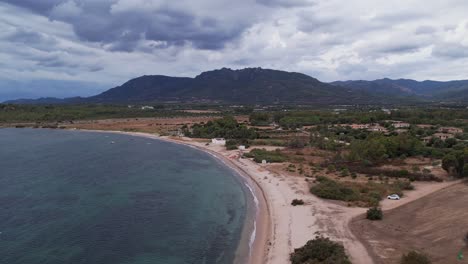Aerial-Parallax-View-Of-Spiaggia-Porto-d'Agumu-Beach-In-Sardinia