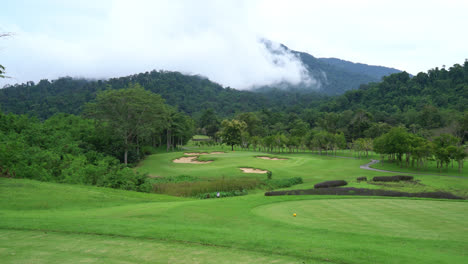beautiful-golf-course-with-mountain-hill-background