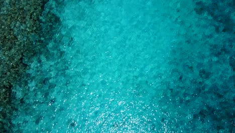 Top-down-turquoise-waters-of-the-beautiful-Philippines,-calm-flowing-ripples-4k