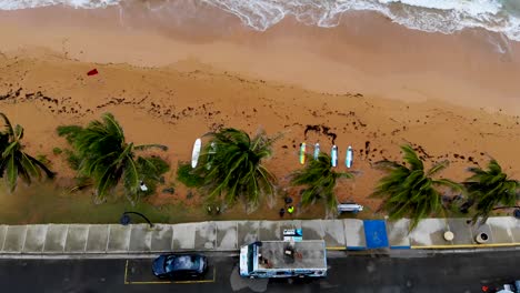 Aerial-View-of-Surf-Boards-Laying-on-a-Tropical-Beach