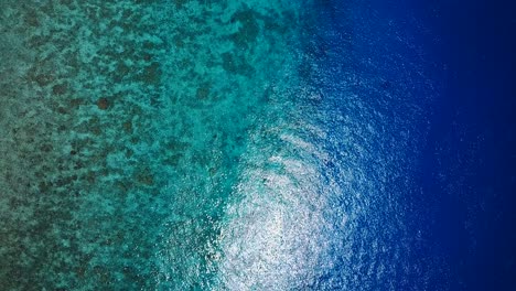Crystal-clear-soothing-ocean-in-slow-orbit-from-above