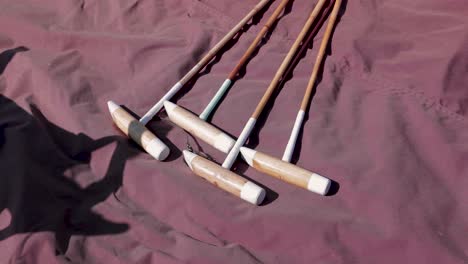 Polo-Mallets-Laying-on-Tarp