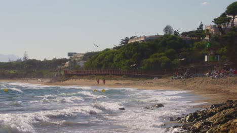 Static-shot-of-Andalusia-coastline-in-slow-motion-with-seagulls-flying-by