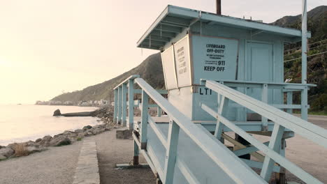 Aesthetic-sky-blue-lifeguard-station-on-the-shoreline-of-Big-Rock-beach-of-Malibu-California