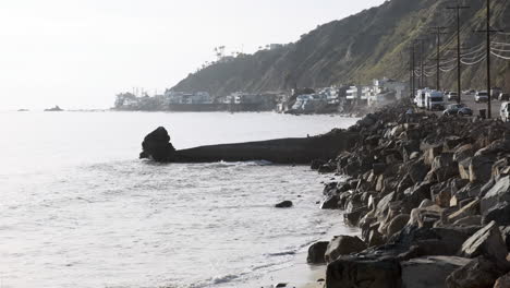 Serene-rocky-stone-shoreline-next-to-a-edge-road-on-Big-Rock-Malibu-beach-California