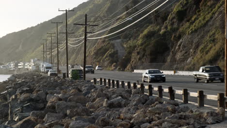 Beach-driveway-narrow-road-highway-next-to-Big-Rock-Malibu-in-California-with-flowing-traffic