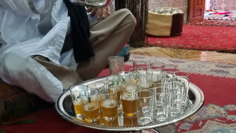 shot-of-a-man-serving-tea-in-the-city-of-Ayoun