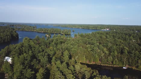 Crane-drone-view-of-a-remote-cottage-lake