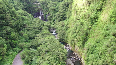Drone-flight-along-a-river-towards-the-Grand-Galet-Falls-at-the-Cascade-Langevin-on-the-island-of-Réunion