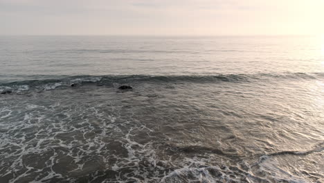 Reminiscing-on-the-shoreline-beach-of-Big-Rock-Malibu-California-at-soothing-golden-hour
