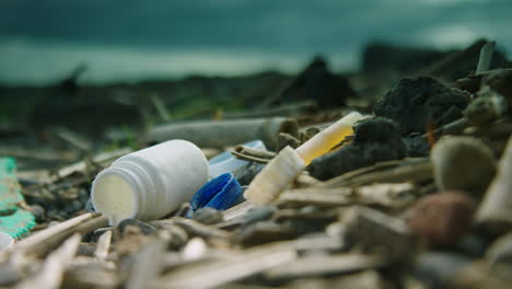 Close-up-shallow-focus-shot-of-washed-up-plastic-on-the-beach