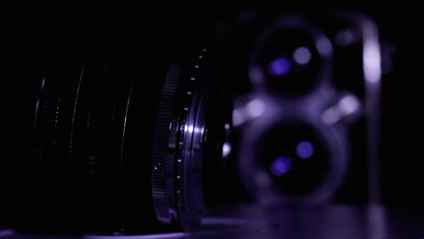 Close-up-shot-of-a-vintage-camera-lens-rotating-on-display