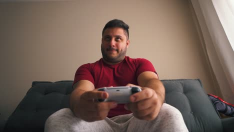 Guy-focused-playing-video-games-with-joystick