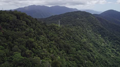 Transmission-Tower-On-Forested-Mountain-In-Cairns-Region,-Queensland,-Australia