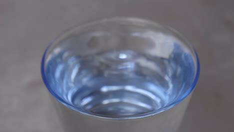 close-up-of-a-water-drop-in-a-glass