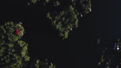 Top-down-drone-view-of-a-remote-cottage-lake