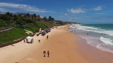 Flyover-Beautiful-beach-with-Turquoise-water-people-walking-on-Sand,Natal