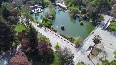 Aerial-view-of-the-lagoon-in-Quinta-Normal-park,-boating-activities,-sunny-day-in-Santiago,-Chile