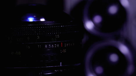 A-vintage-camera-lens-slowly-rotates-in-a-close-up-shot-with-dramatic-contrast-lighting