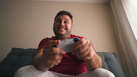 Man-excited-playing-video-games-celebrating-achievment-victory