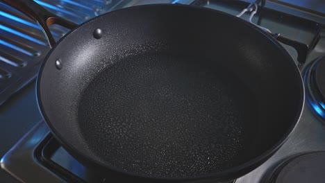 Hot-Skillet-Sprayed-With-Cooking-Oil-In-The-Kitchen