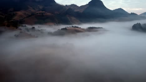 Smooth-dolly-in-aerial-over-low-lying-clouds-in-the-fantasy-landscape-of-Sao-Bento-Do-Sapucai-in-Sao-Paulo-Brazil