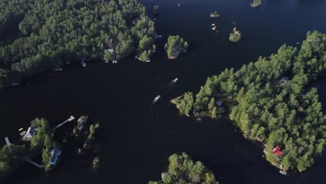 Push-in-drone-view-of-a-remote-cottage-lake