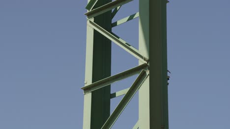 Minimal-closeup-shot-of-metal-structure-coated-with-green-varnish,-tilt-up