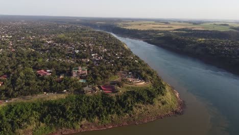 circular-drone-flight-shows-Hito-tres-fronteras-at-the-Iguazu-River-Monument-in-Misiones,-where-the-borders-of-Brazil,-Argentina-and-Paraguay-meet