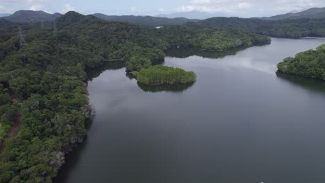 Aerial-View-Over-Calm-Waters-Of-Copperlode-Dam-Or-Lake-Morris-In-Cairns-Region,-Queensland,-Australia---drone-shot