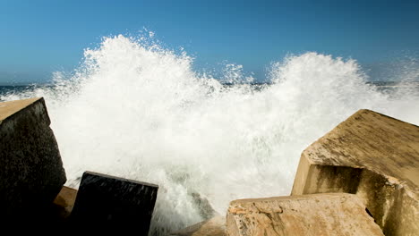 Incessant-waves-crash-into-dolosse-protecting-the-harbour-wall