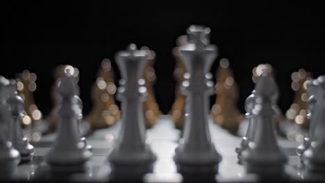 Close-up-sliding-shot-starting-its-focus-on-one-side-of-an-ornate-chessboard-and-shifting-to-the-opponent's-side