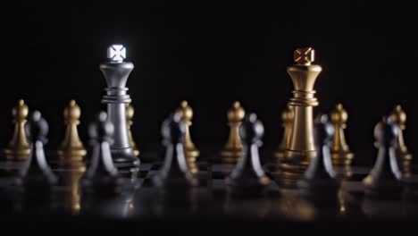 From-darkness-chess-board-is-lit-up-revealing-two-rival-kings-squaring-off