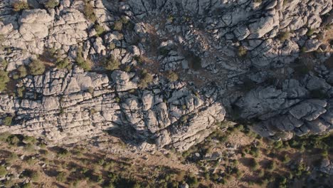 Aerial-drone-top-down-shot-over-rocky-mountain-tops-in-Torcal-de-Antequera-seen-from-above
