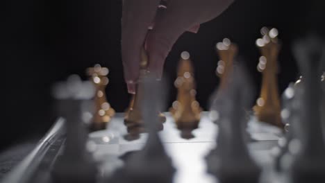 Sliding-shot-of-a-hand-moving-a-bishop-across-the-chessboard
