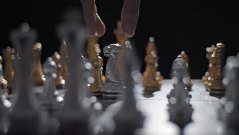 Cinematic-shot-of-a-knight-taking-out-a-pawn-in-a-game-of-chess