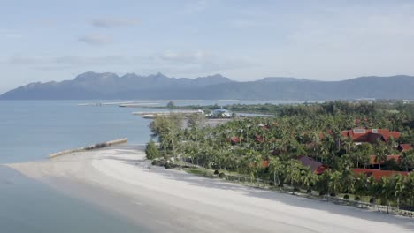 Langkawi-top-view-tracking-shot,-no-people,-daylight,-coastline,-beach,-trees-and-houses