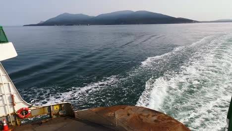 Ferry-Boat-Stern-Sailing-And-Creating-Wake,-Traveling-From-Anacortes-To-Orcas-Island-In-Washington,-USA