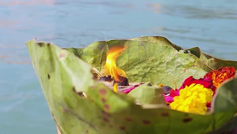 worship-offerings-to-holy-river-ganges-at-morning-from-flat-angle-video-is-taken-haridwar-uttrakhand-india-on-Mar-15-2022