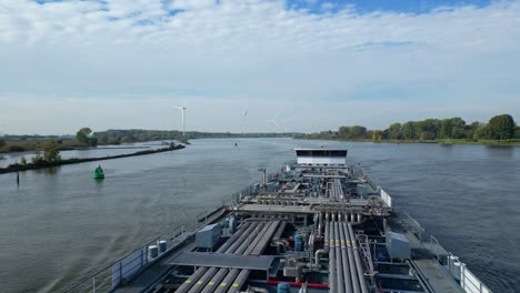 Flying-Over-Tanker-Ship-Navigating-On-A-River-In-Barendrecht,-Netherlands
