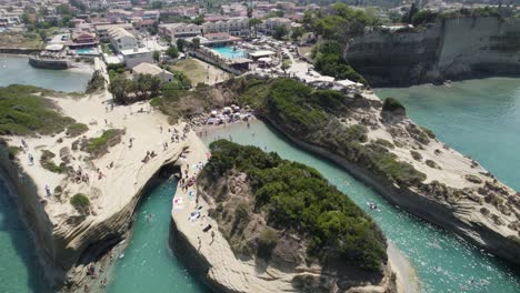 Aerial-orbiting-view-of-Beautiful-Canal-d´amour,-Scenic-Turquoise-beach-between-White-rock-Formation,-Sidari,-Corfu-Island