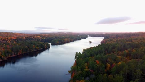 Pan-over-the-water-of-a-pond-in-Maine-during-the-Fall-season