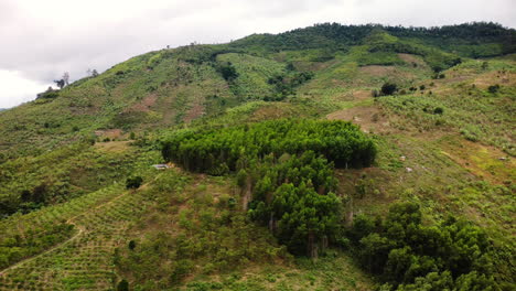 Aerial-backwards-view-of-a-rural-landscape-deforested-in-Vietnam