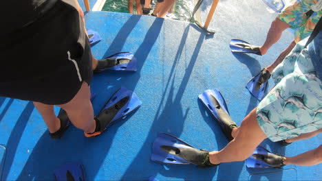 All-tourists-are-ready-with-fins-on-for-snorkeling-and-diving-in-water-|-people-prepared-for-swimming-and-diving-in-water-with-fins-on