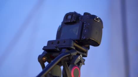Close-up-of-a-compact-camera-with-tripod-taking-a-burst-shot