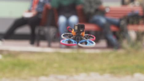 FPV-drone-mounted-with-a-POV-camera-moving-towards-the-camera-head-on-moving-away-at-last-moment-avoiding-the-camera