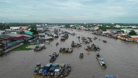 Early-Morning-Aerial-View-of-Cai-Rang-Can-Tho-Floating-Market,-Boats-Vendors-and-Trading-in-Busy-Traditional-Market