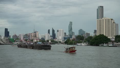 Heavy-Industrial-Cargo-Freight-Transport-Industry-Shipping-Vessel-on-Chao-Phraya-Bangkok-Waterway