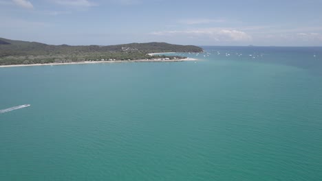 Flying-Over-Turquoise-Seascape-At-Great-Keppel-Island-During-Summer-In-Queensland,-Australia---drone-shot
